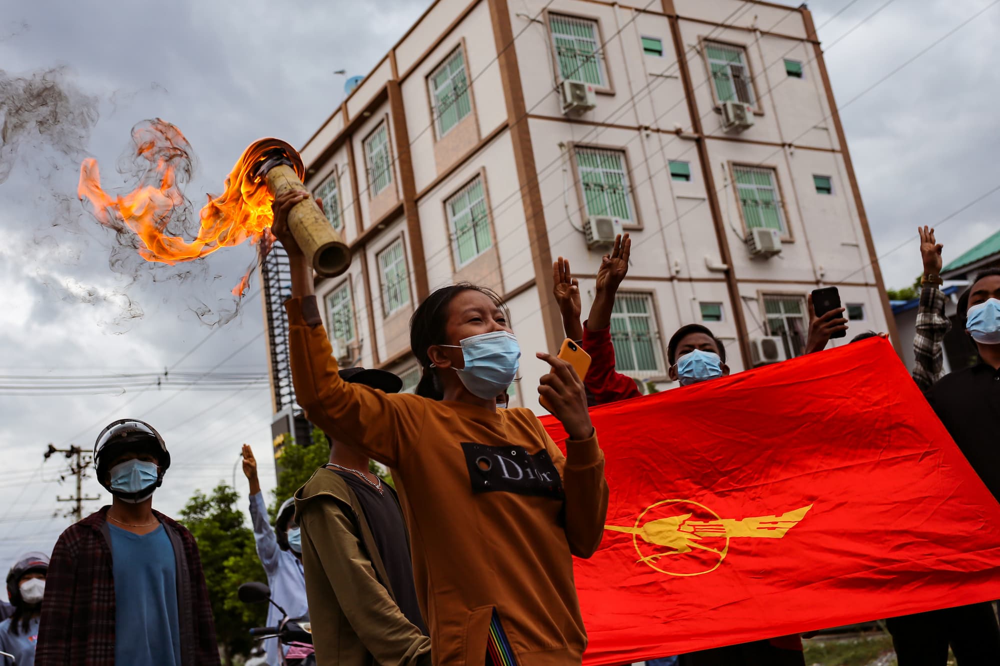 A woman holding a torch