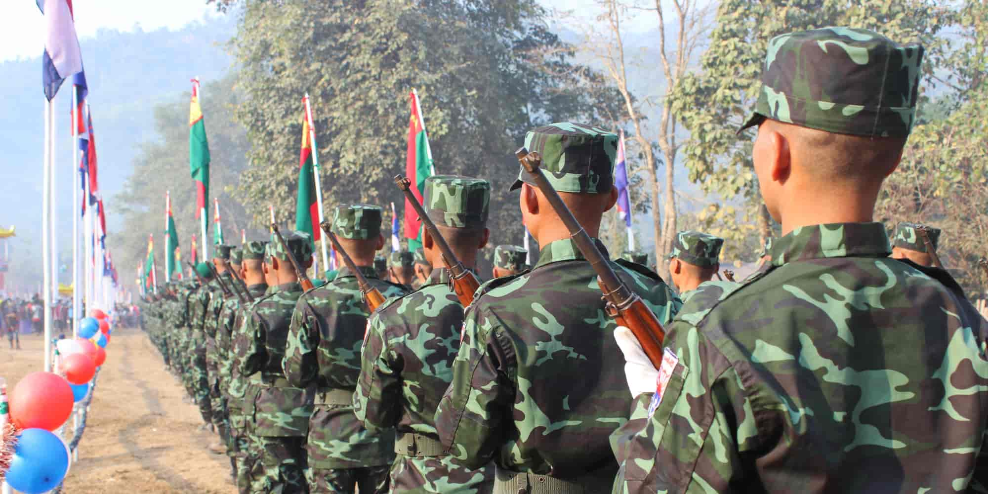 Camouflaged soldiers marching in formation