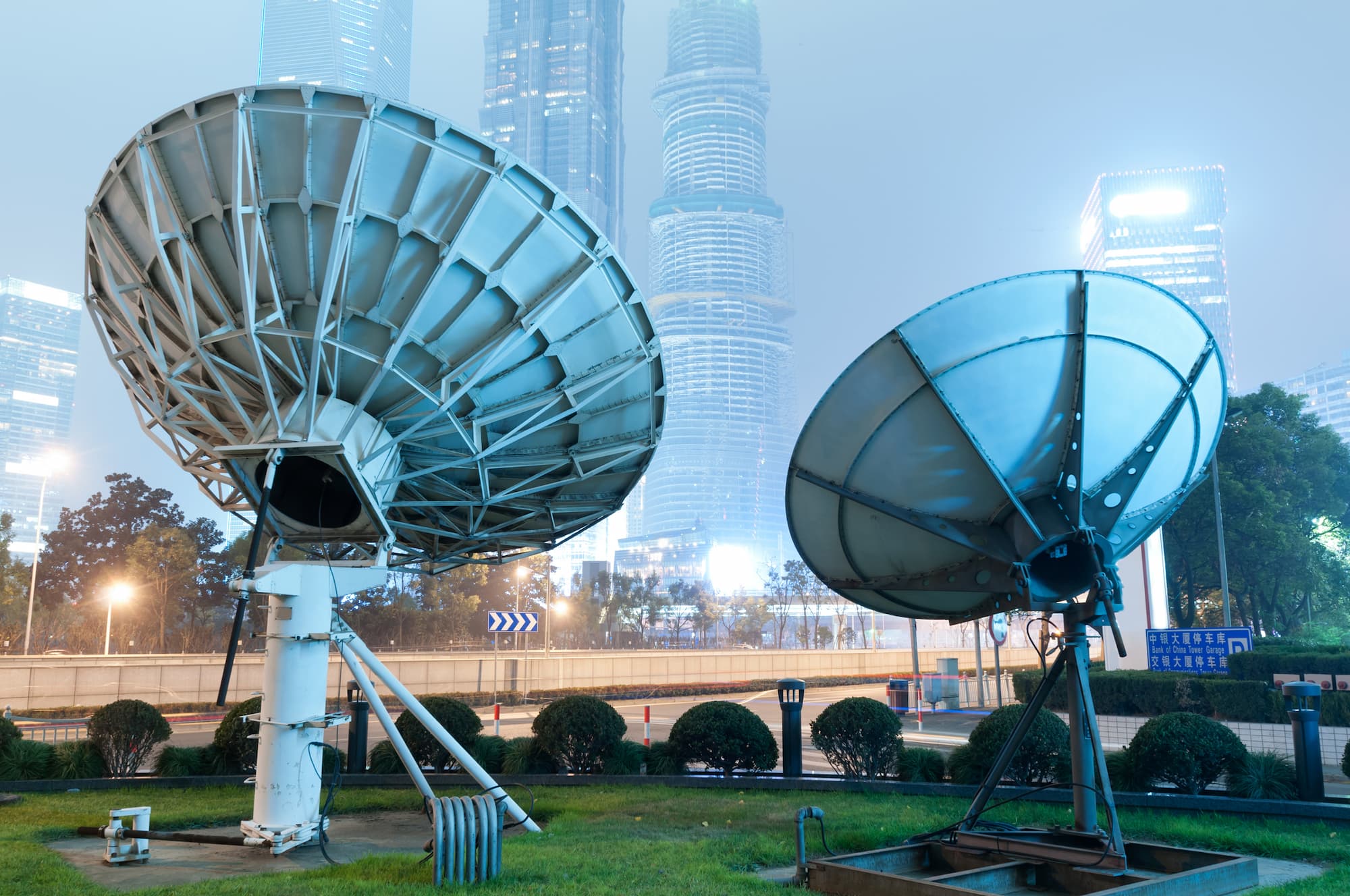 Two satellite on a green lawn