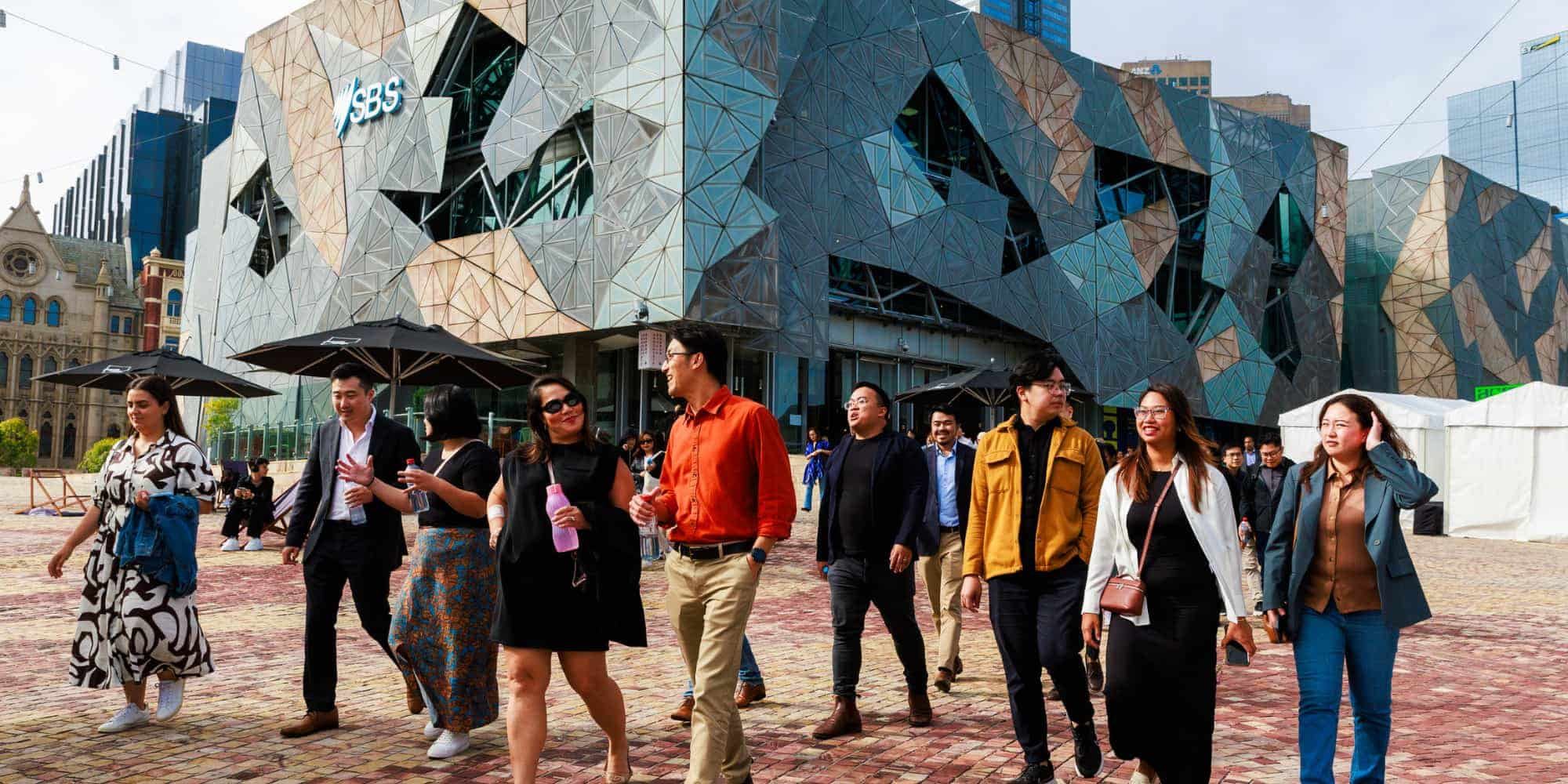 People walking together in Fed Square