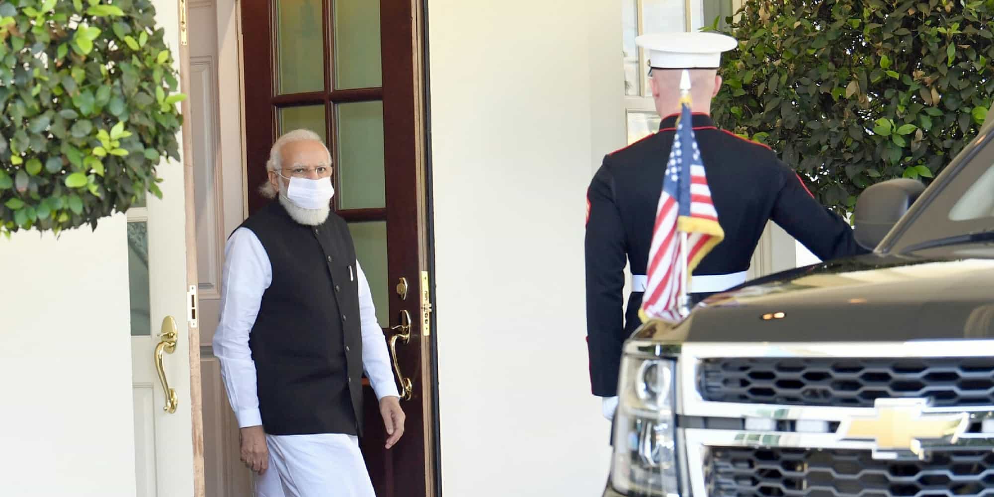 Modi walk out of the building