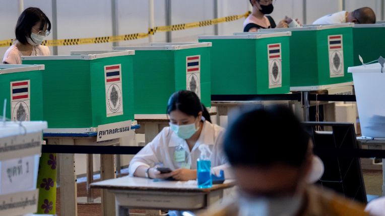 Thai cast their vote for the election at a polling station