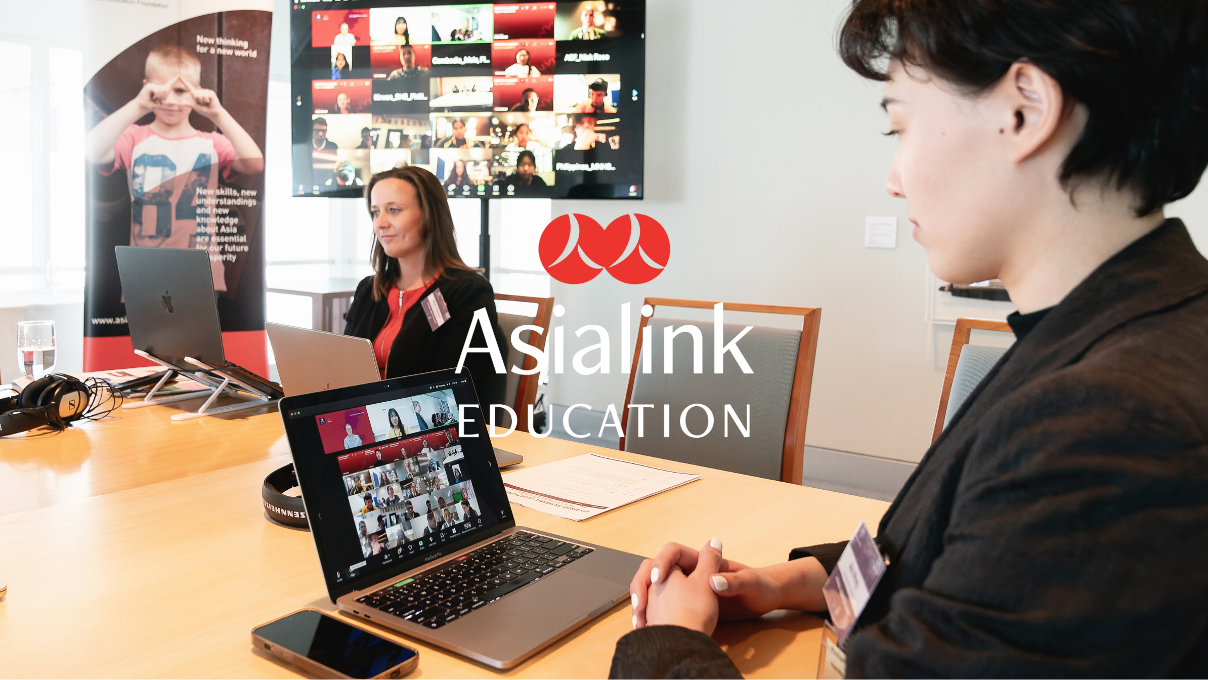 Two women participate in a virtual conference call.