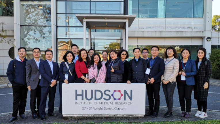 in bound study group from china in front of building