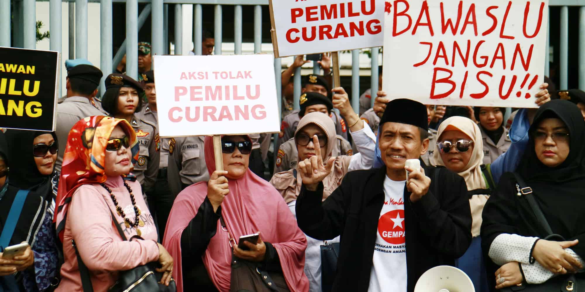 People protested to Indonesia election supervisory agency, calling for repeated elections