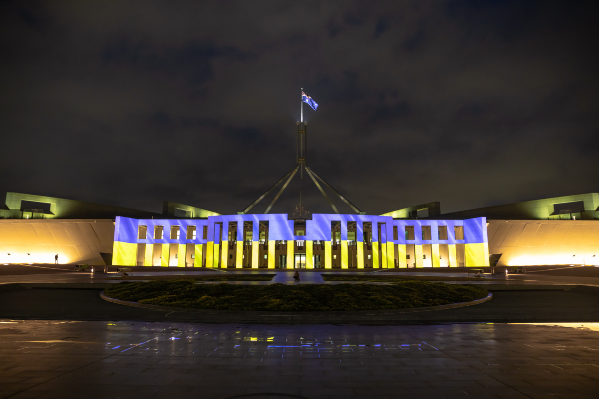 Australian Parliament House lit up in the colours of Ukraine's flag