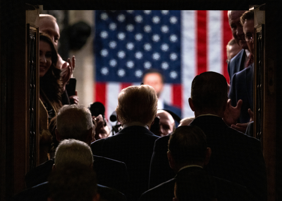 US President Donald Trump enters the House Chamber
